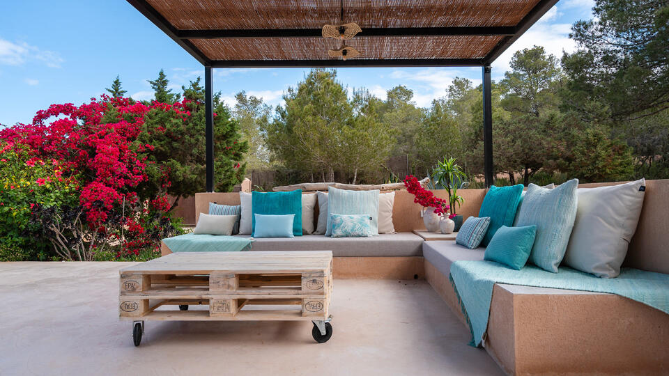 Relaxing area under a pergola at Villa Tiramar in Ibiza