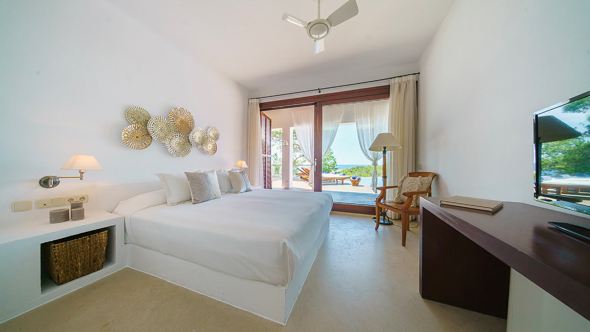 Bedroom photos with fresh white linens throughout the luxury villa rental in Voramar