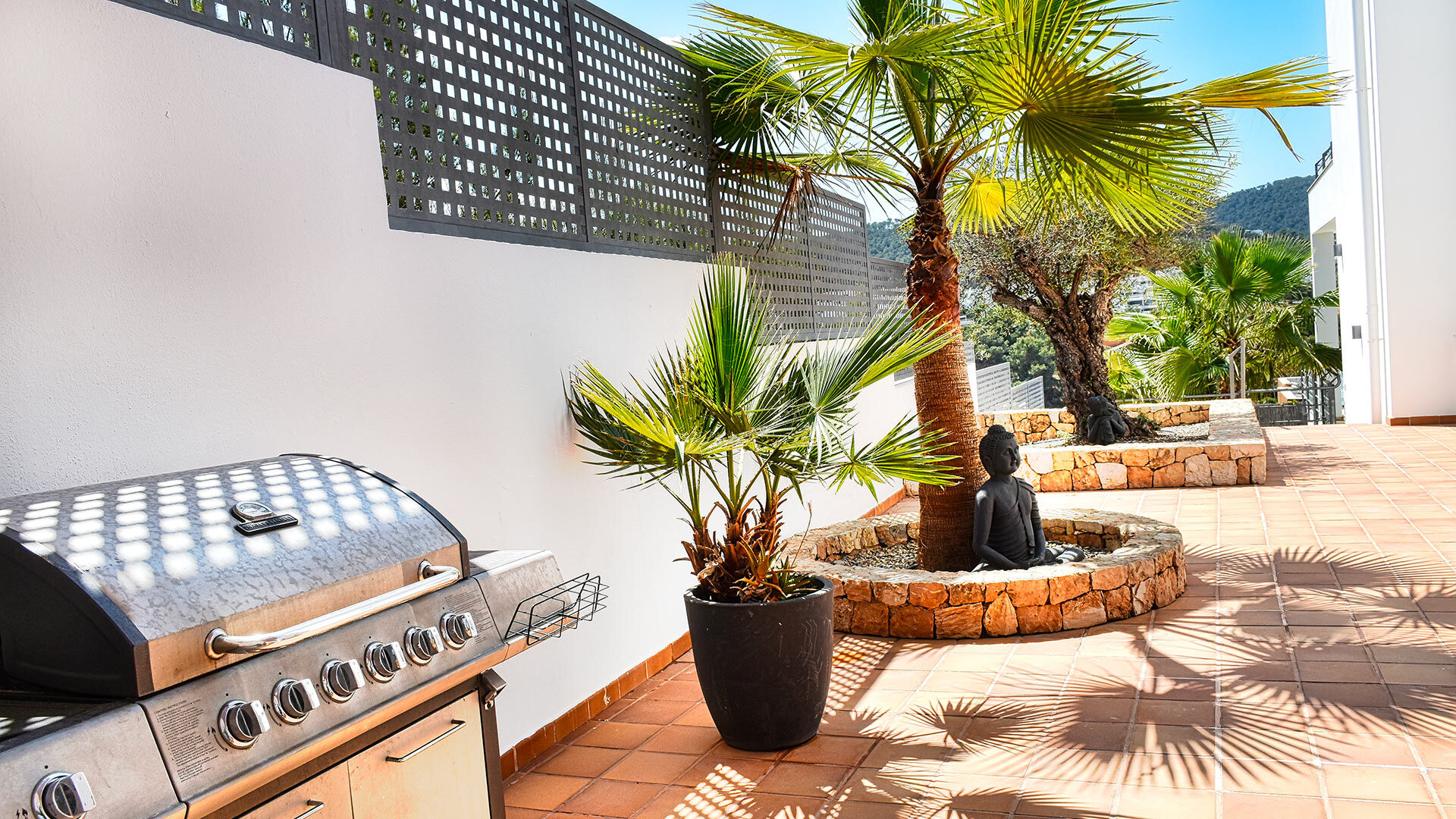 The BBQ and outdoor dining area at Villa White Beach in Ibiza
