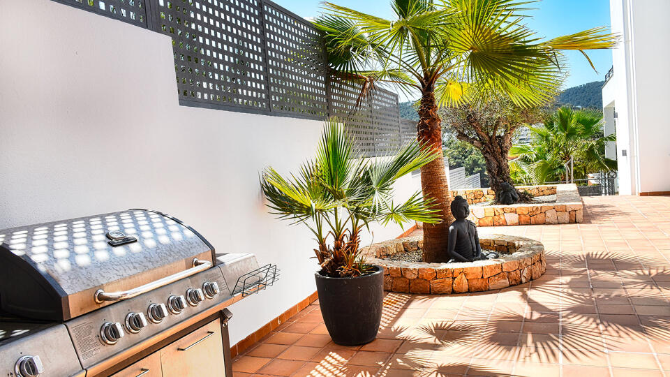 The BBQ and outdoor dining area at Villa White Beach in Ibiza
