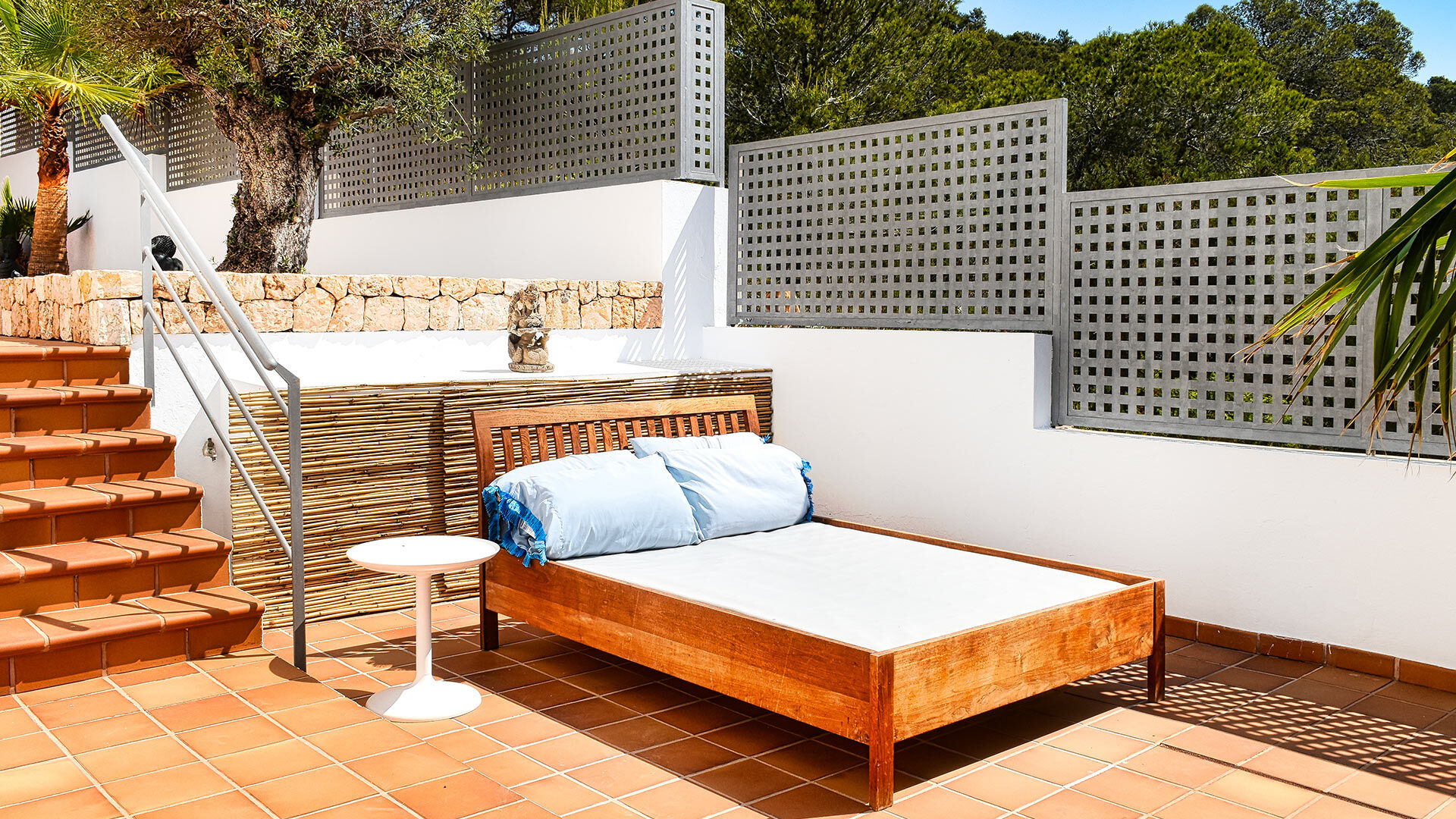 A large daybed outside at Villa White Beach in Ibiza getting unlimited sun