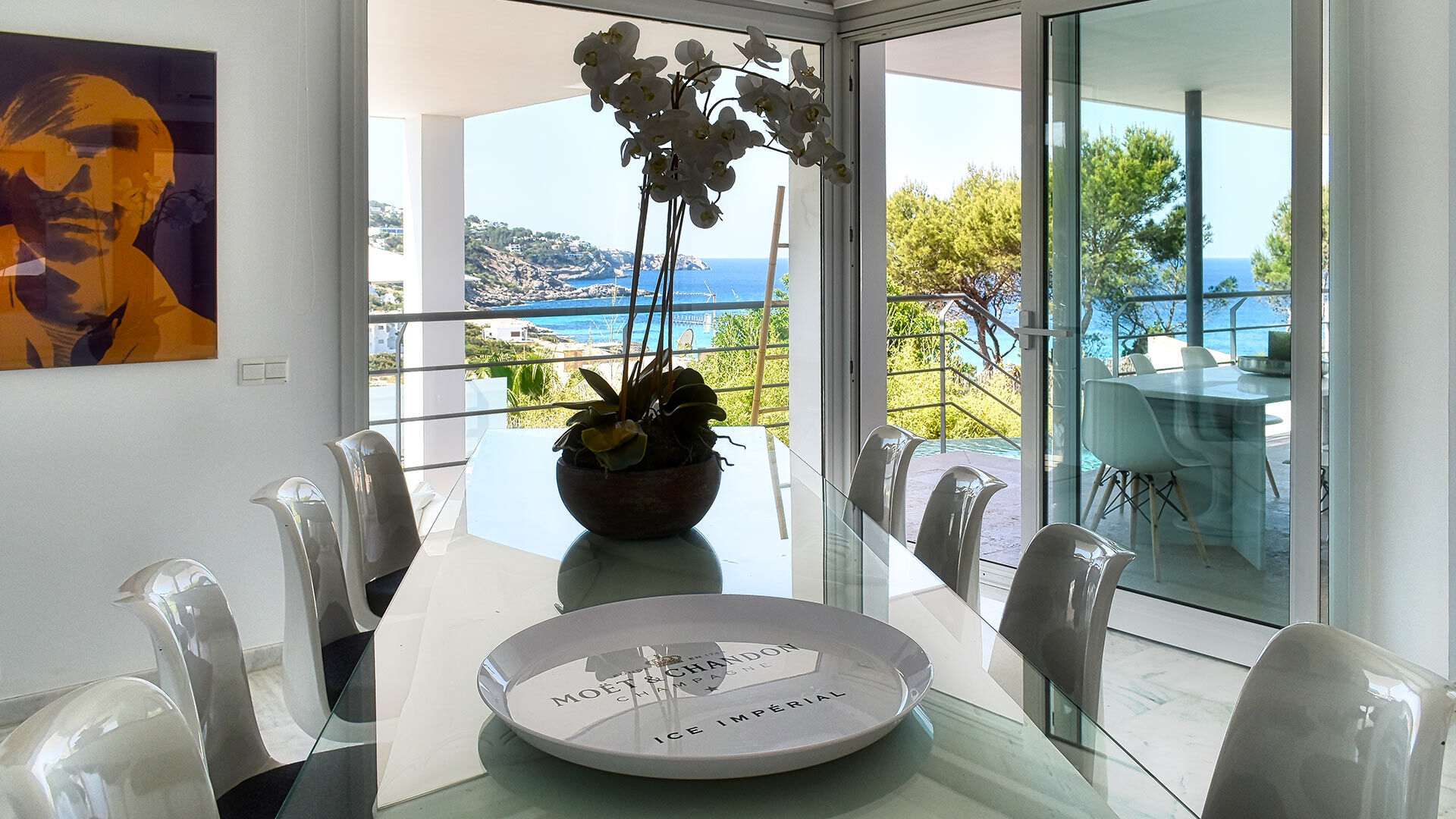 Large dining room area with open french doors at Villa White Beach in Ibiza