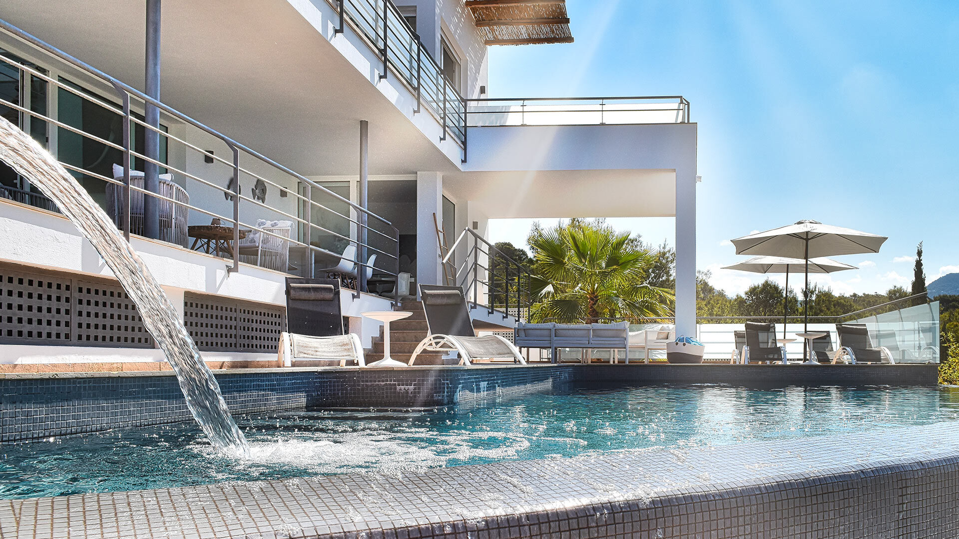 Beautiful pool at Villa White Beach in Ibiza with water fountain feature
