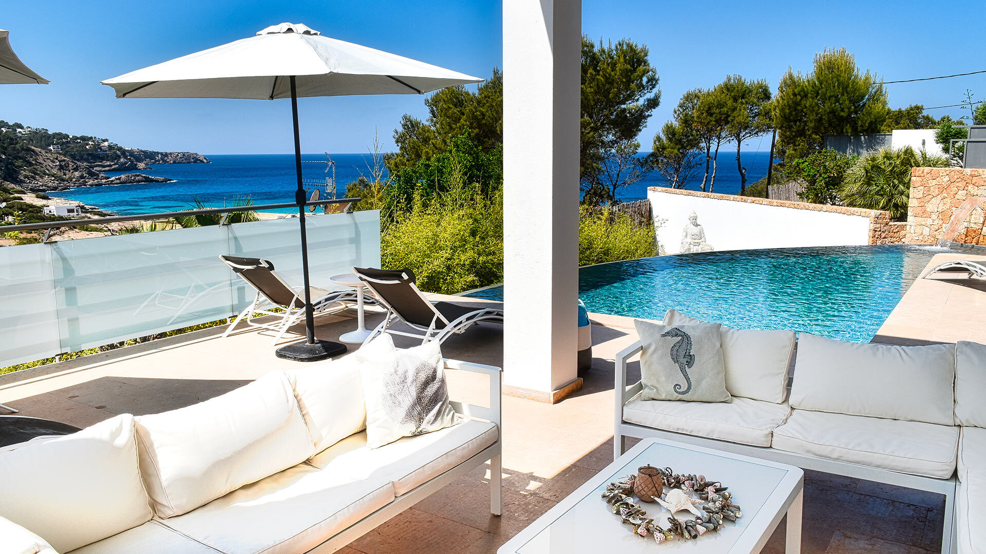 Shaded exterior seating space at luxury rental villa White Beach in Ibiza