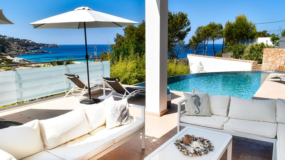 Shaded exterior seating space at luxury rental villa White Beach in Ibiza