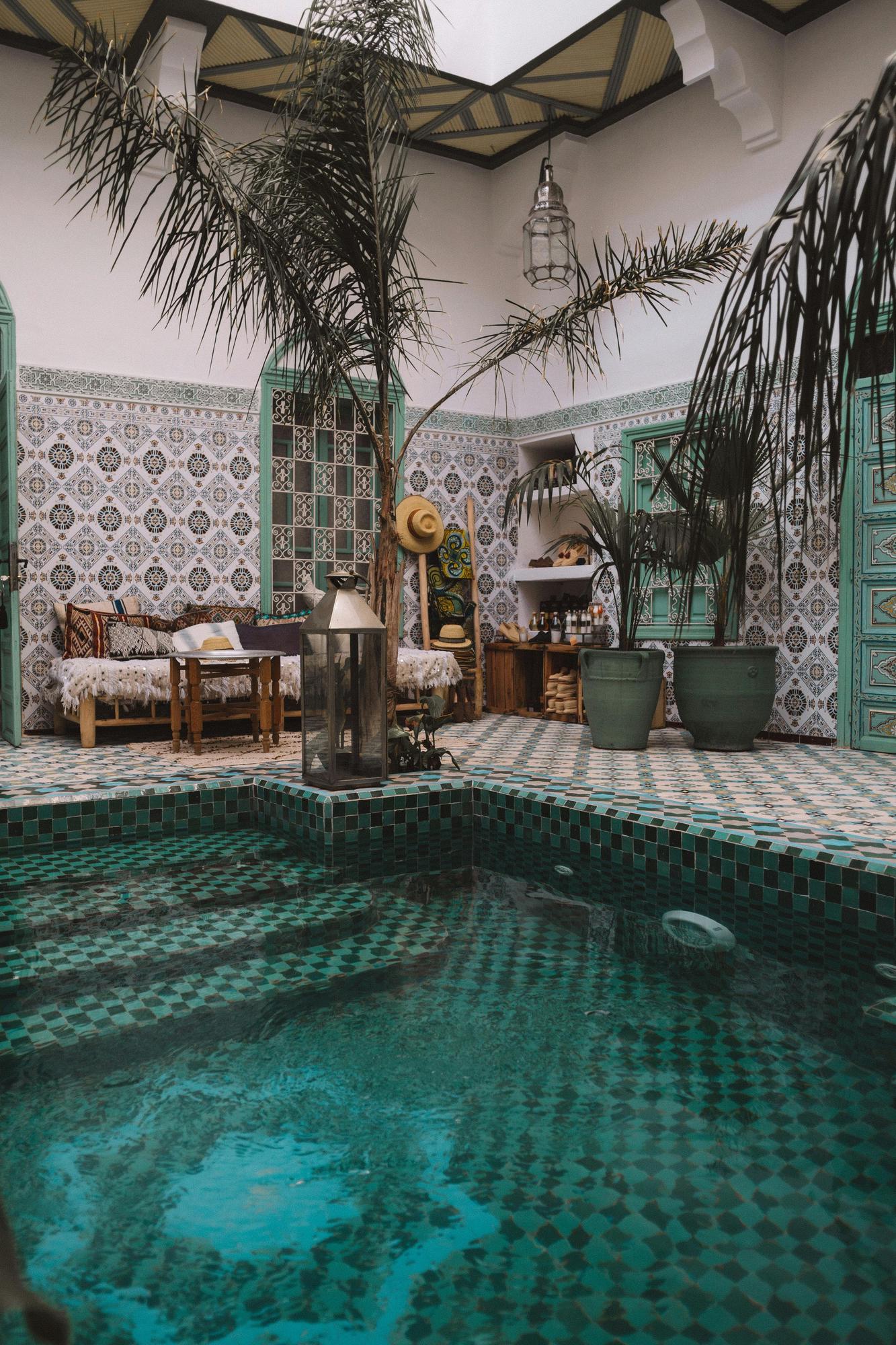 Inside of a beautifully tilled riad in a Marrakech luxury riad