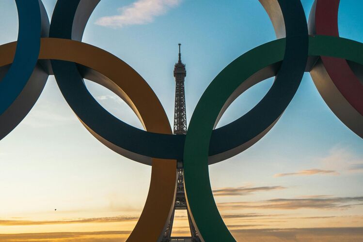 The Olympic Rings in the foreground with the Eiffel Tower, in Paris, in the background ahead of the 2024 Olympics