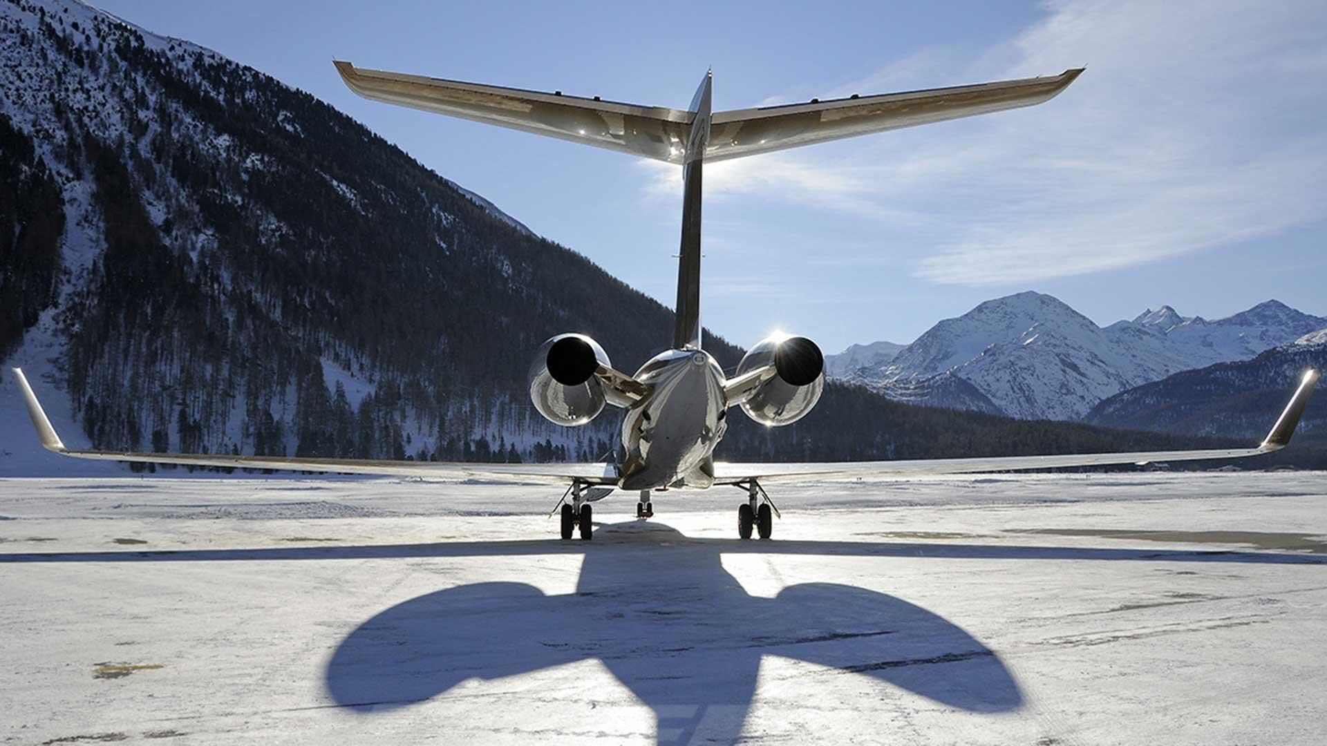 Private jet in a winter mountain scene