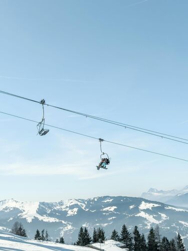 Skiers going down the lift of Mont Blanc In Chamonix