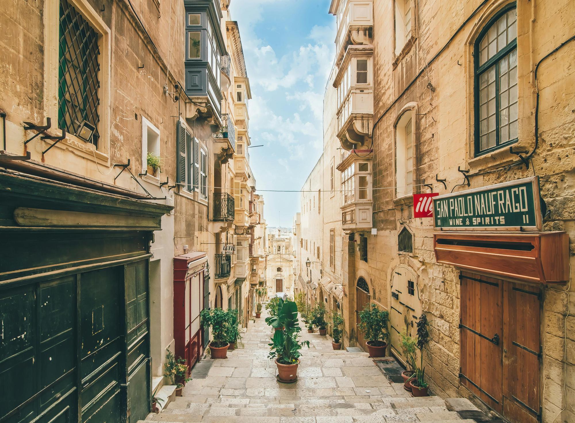 A charming street in Malta with quaint looking shops