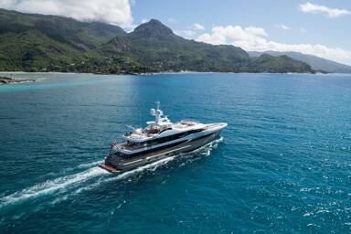 Starboard view of motor yacht Amigos sailing on charter with Bluemoon