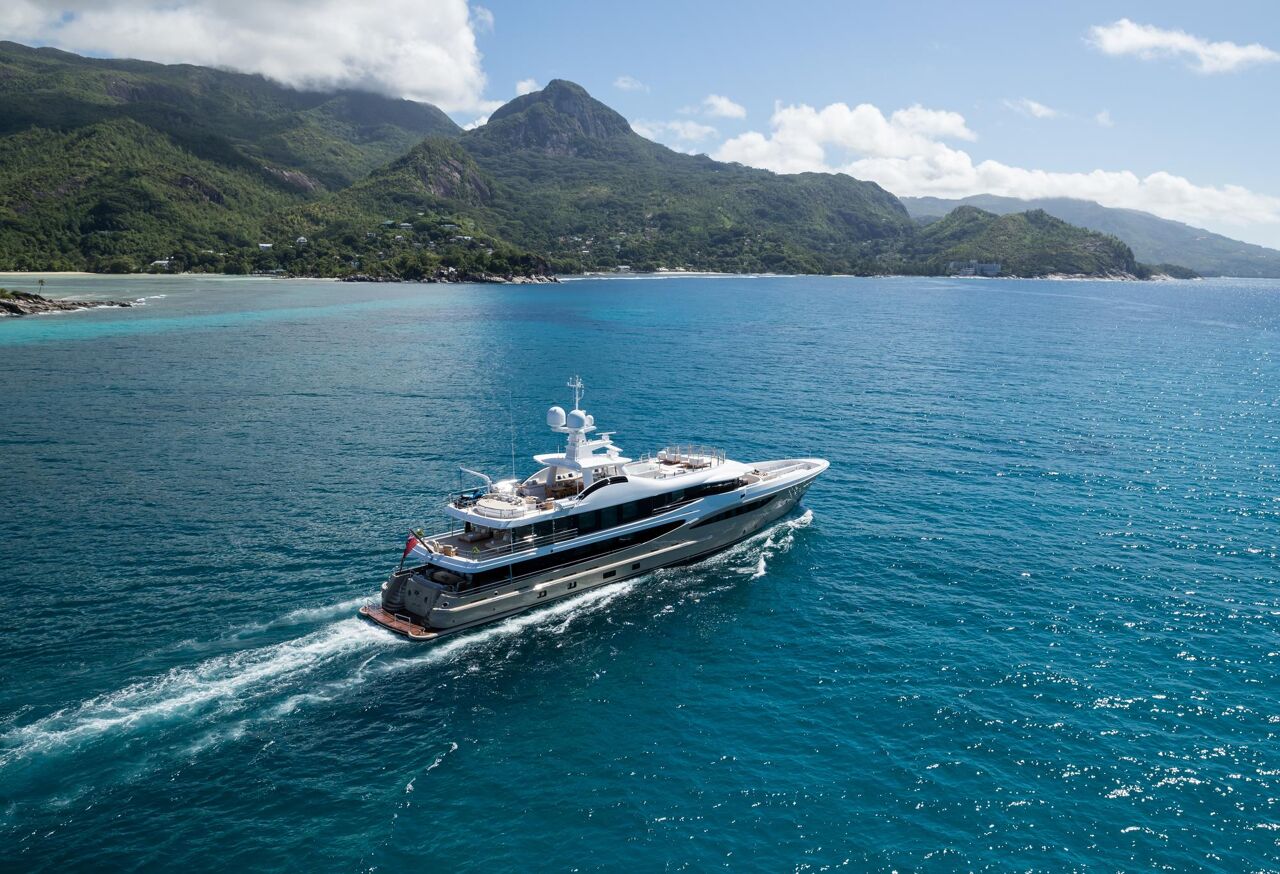 Starboard view of motor yacht Amigos sailing on charter with Bluemoon