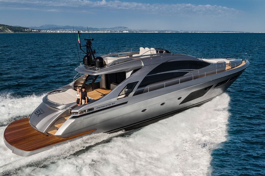 View of the aft of charter yacht Cherry sailing with a couple standing on deck