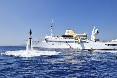 Port side of Christina O motor yacht chartering with Bluemoon