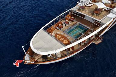 The bow of Christina O, dining spaces and swimming pool