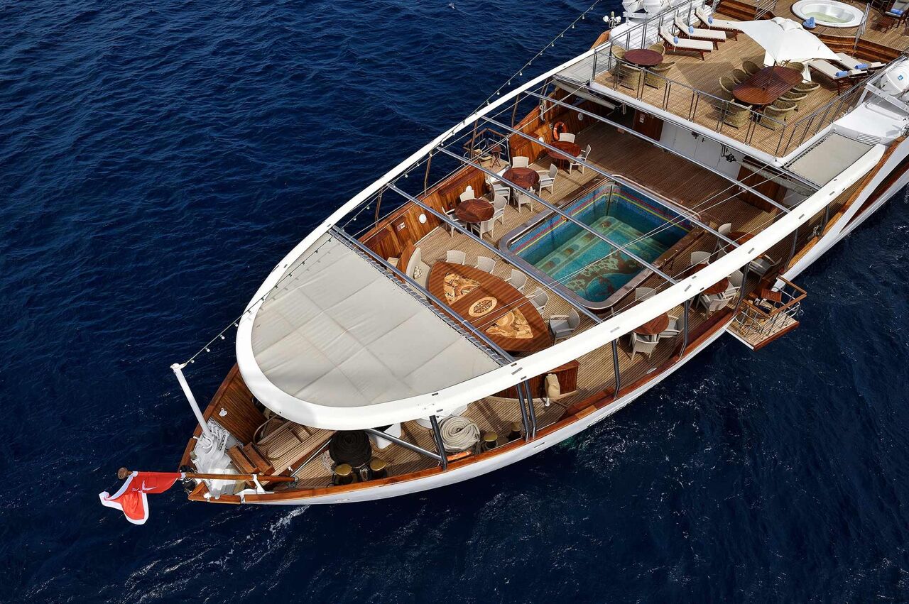 The bow of Christina O, dining spaces and swimming pool