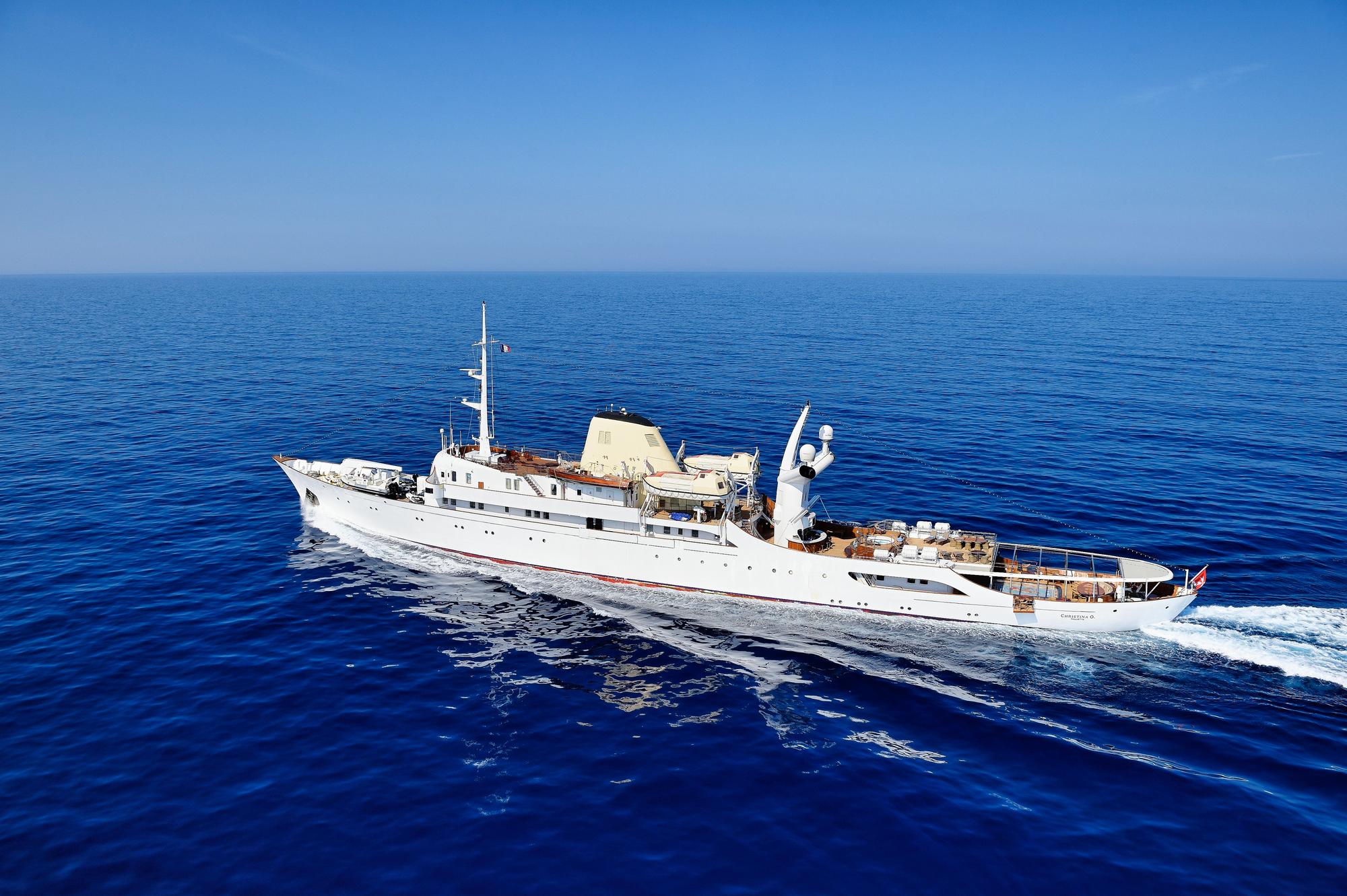 Motor yacht Christina O on sail in crystal blue waters. Available for charter.