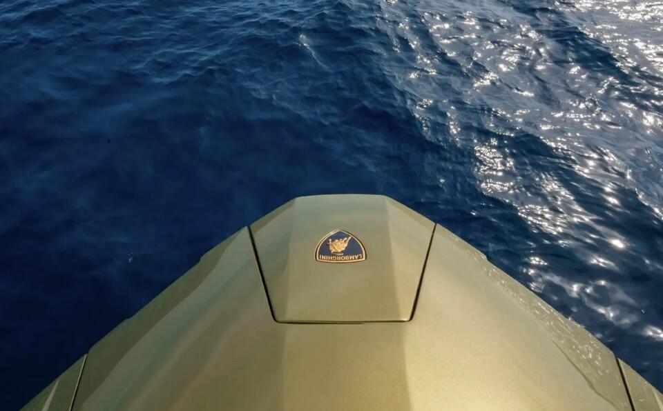 The Lamborghini crest at forward of charter yacht Fast One