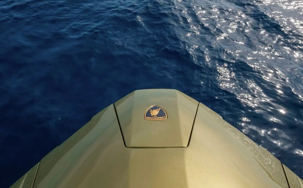 The Lamborghini crest at forward of charter yacht Fast One