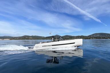 Starboard side of Fjord 44 Open peacefully sailing with plane flying above it