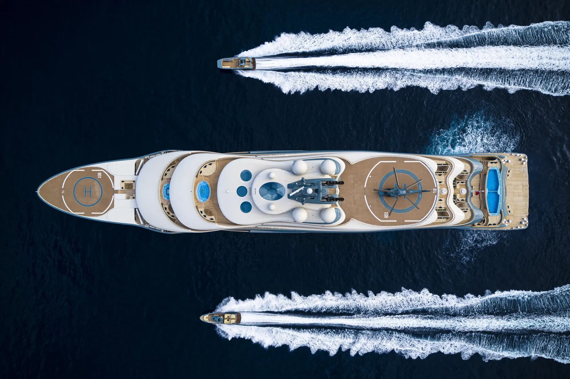 Aerial view of super yacht Flying Fox with two tenders sailing either side of this incredible yacht