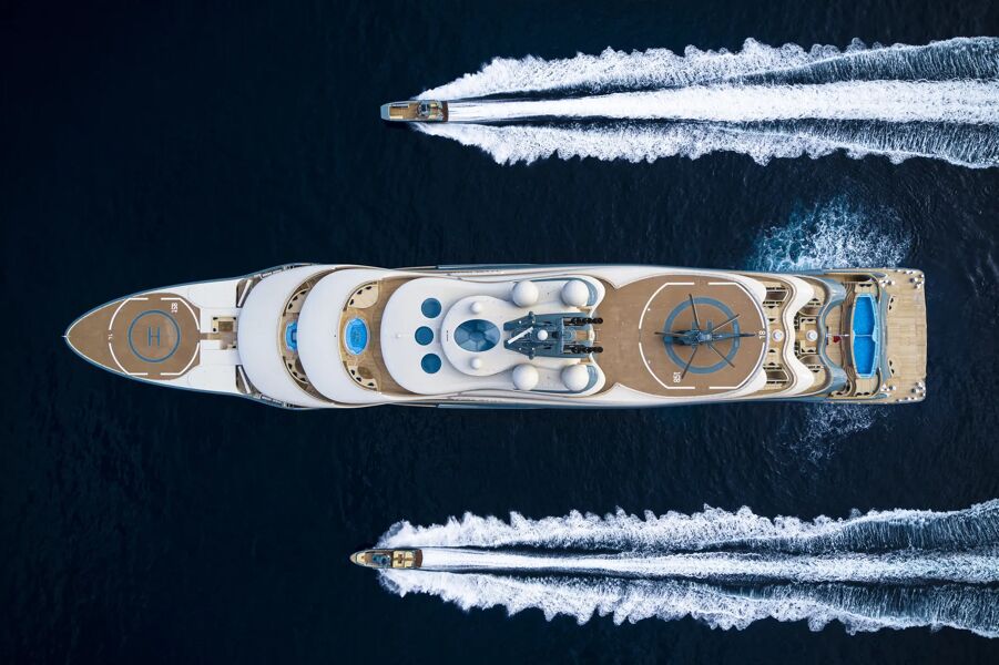 Aerial view of super yacht Flying Fox with two tenders sailing either side of this incredible yacht