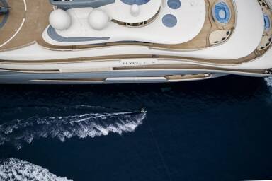 Aerial view of Flying Fox's starboard with the charter yachts logo on show on charter with Bluemoon