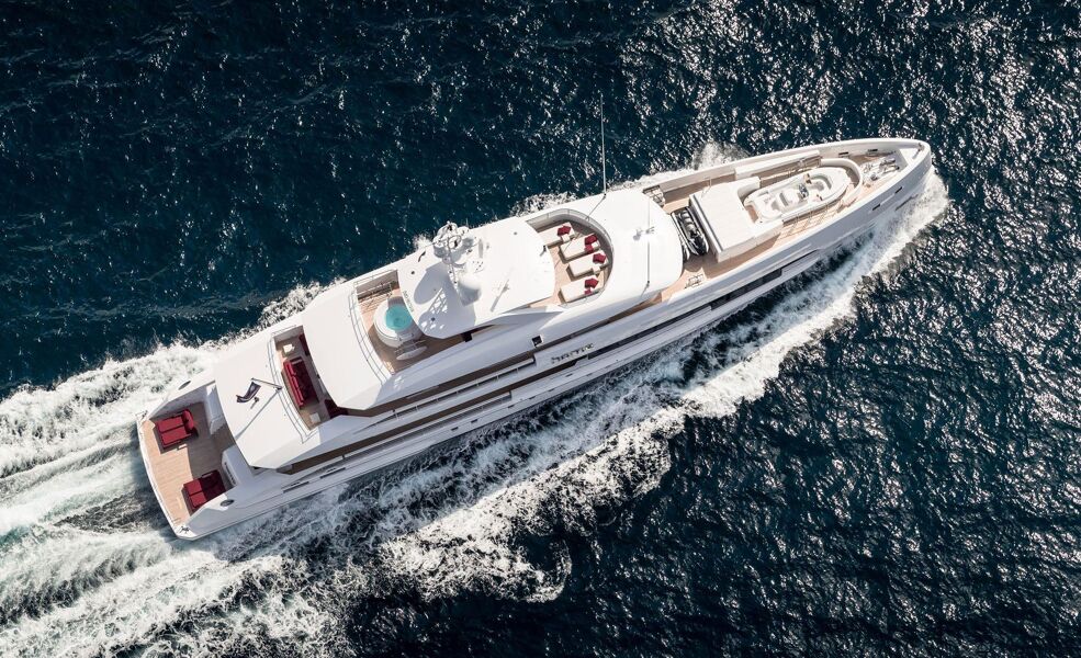 Aerial view of motor yacht Home cutting through the seas