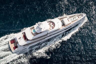 Aerial view of motor yacht Home cutting through the seas
