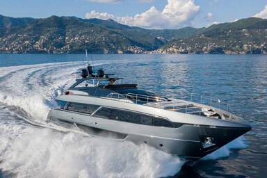 Starboard of motor yacht Maximus cutting through the waters on charter with Bluemoon