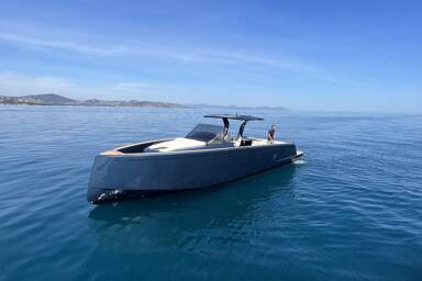 Bow view of Pardo 43 at anchorage surrounded by beautiful water and tall mountains with Captain aboard