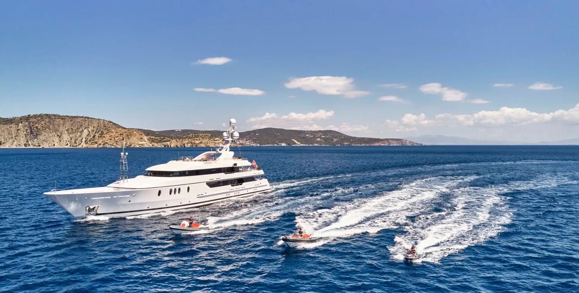 View of Seahorse yacht charter with tenders and jet ski riding alongside