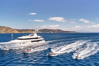View of Seahorse yacht charter with tenders and jet ski riding alongside