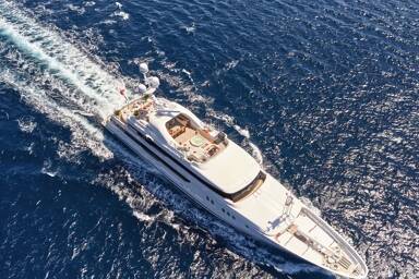 Aerial view of charter yacht Seahorse cruising in the sea for charter with Bluemoon