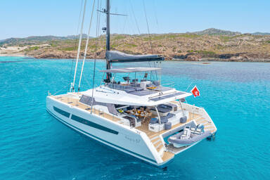 View of Semper Fidelis catamaran yacht at anchor In the beautiful Bahamas trade winds
