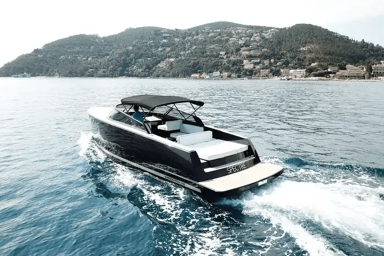 Stern view of VanDutch 32 sailing with the lounging area on display