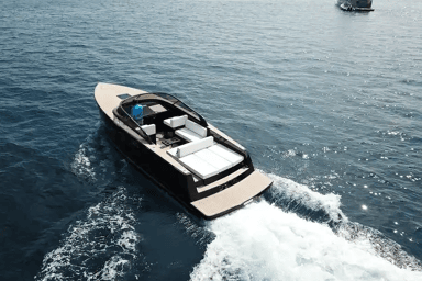 Aerial view of VanDutch 32 with the captain sailing it through