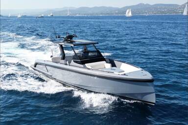 Starboard view of Vanquish 40 Sports Line sailing along the sea with mountains in the background