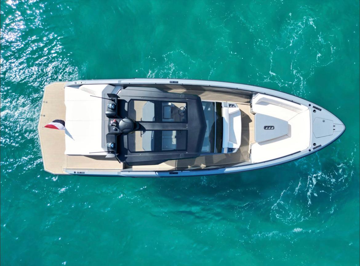 Aerial view of Vanquish 40 Sports Line at anchorage in the turquoise waters
