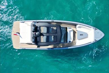 Aerial view of Vanquish 40 Sports Line at anchorage in the turquoise waters