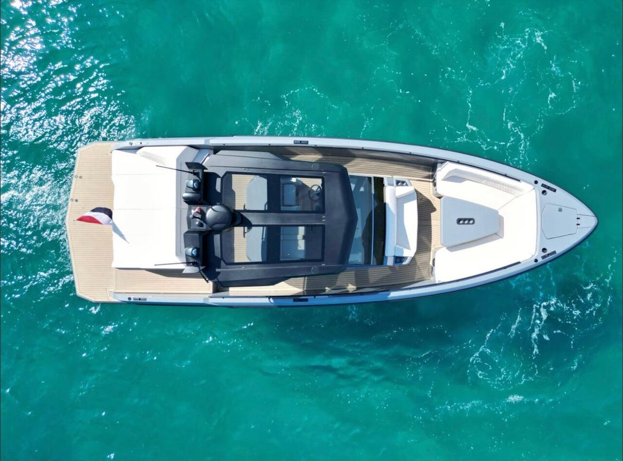 Aerial view of Vanquish 40 Sports Line at anchorage in the turquoise waters