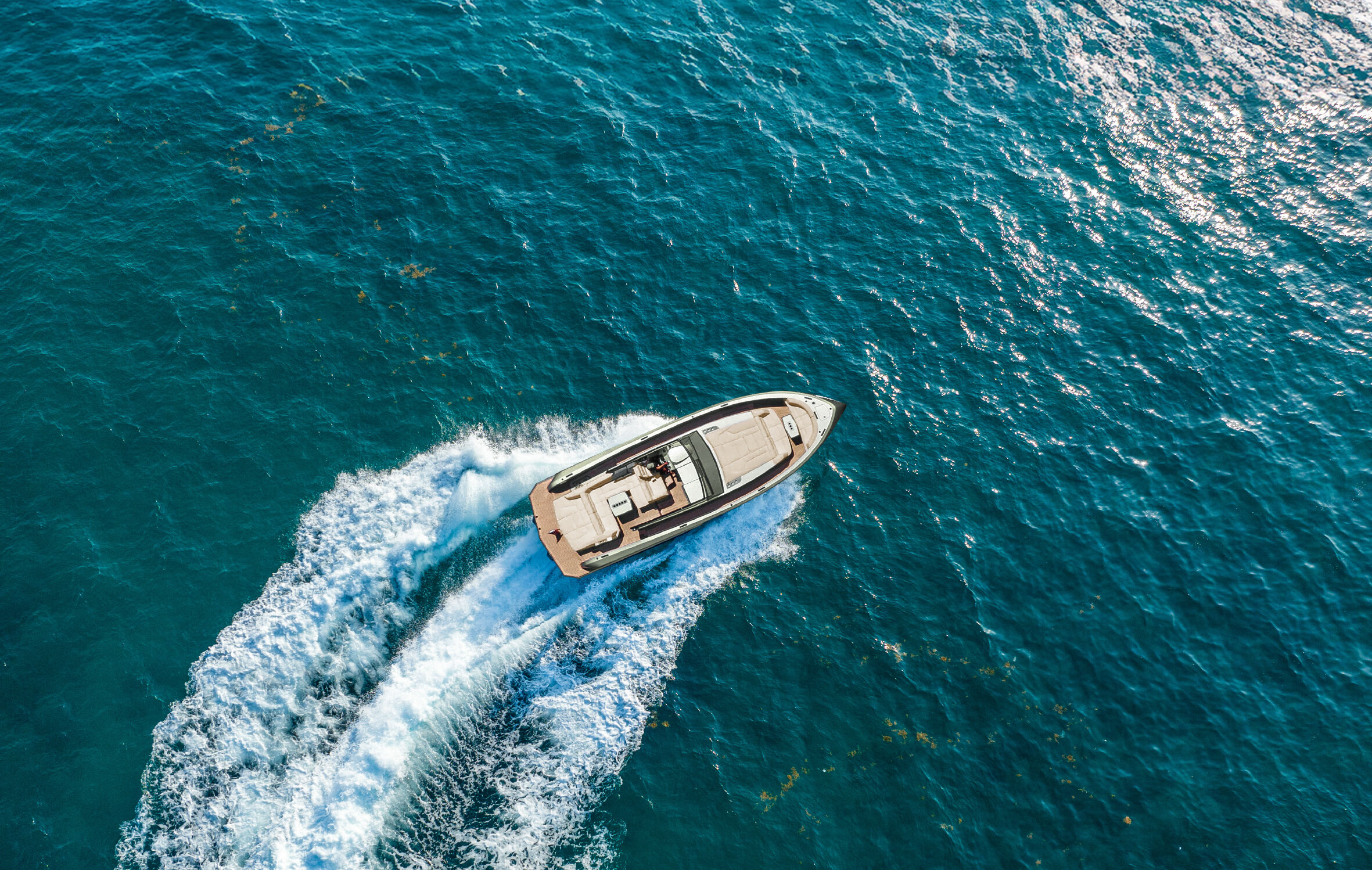 Aerial view of the Vanquish 45 Open turning on the sea