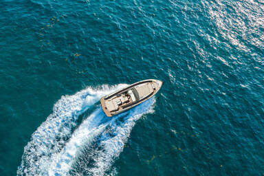 Aerial view of the Vanquish 45 Open turning on the sea