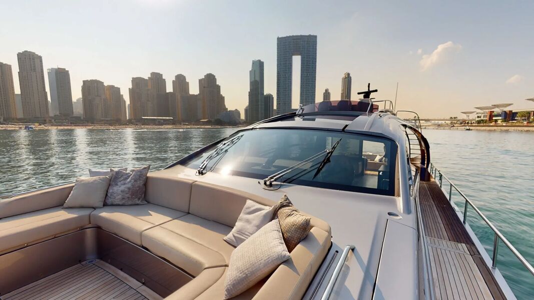 Seating area in the bow of Predator Pershing 8X with Dubai in the background