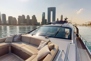 Seating area in the bow of Predator Pershing 8X with Dubai in the background